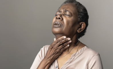 woman dealing with throat pain