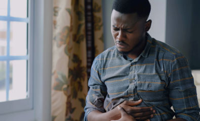 man holding his stomach in pain from gastroparesis