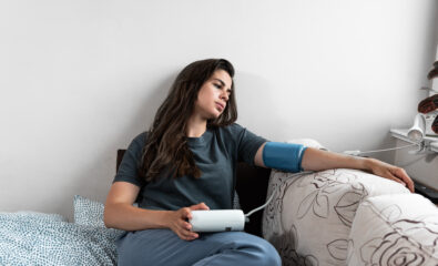 Young Woman checking her blood pressure