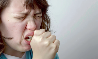 Person coughing into hand