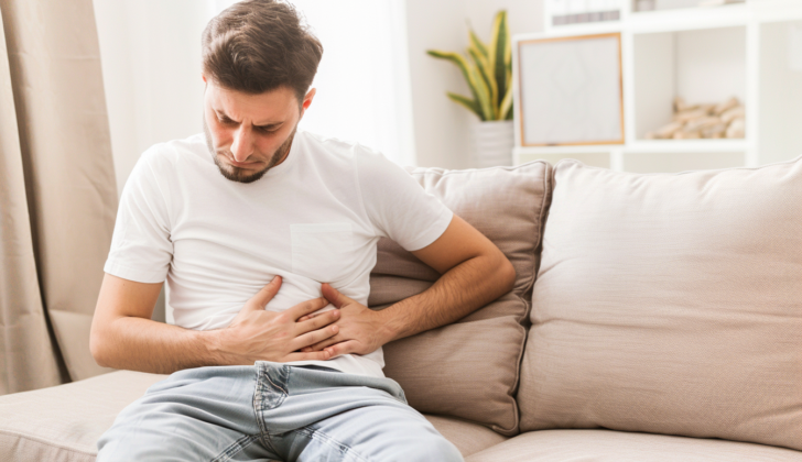 Man with stomach discomfort