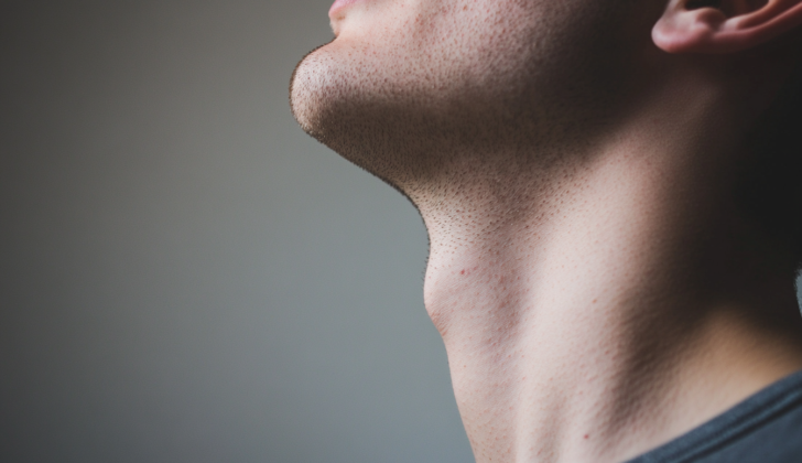 Man with hiccups, a involuntary contraction of the diaphragm muscle followed by a quick closure of the vocal cords, resulting in a distinctive sound.