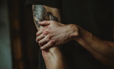 person holding elbow