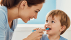 Parent and child practicing speech sounds together during daily activities