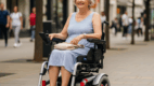 Senior woman using a lightweight power wheelchair