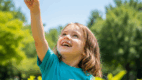 A child pointing to the sky during outdoor play, /sk/ sound