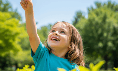 A child pointing to the sky during outdoor play, /sk/ sound