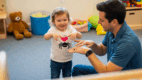 Songs for speech and language: Child acting out “The Itsy Bitsy Spider” with hand motions