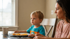 A young child turning away from a plate of food while a parent looks on gently—highlighting ARFID behavior.