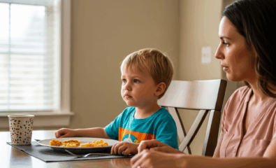 A young child turning away from a plate of food while a parent looks on gently—highlighting ARFID behavior.