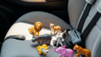 Mini animal toys used for speech sound practice in the car