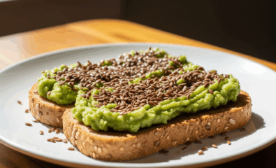 Healthy whole grain toast topped with mashed avocado and flax seeds