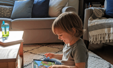 Child enjoying a favorite cartoon, a common source of scripted language