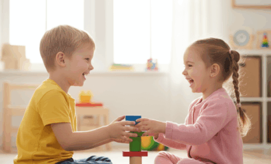 Children practicing sharing during playtime as described in a social story.