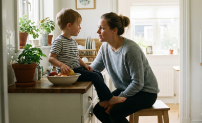 A parent offering calm reassurance to a young child, representing supportive responses to vocal tics in children.