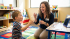 Speech therapist using play-based activities to support oral motor skills and speech development
