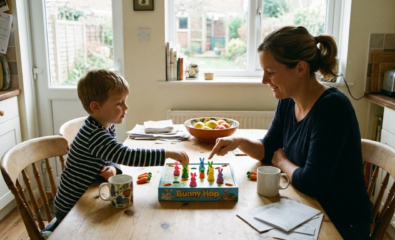 Parent and child practicing turn-taking with a simple board game at home.